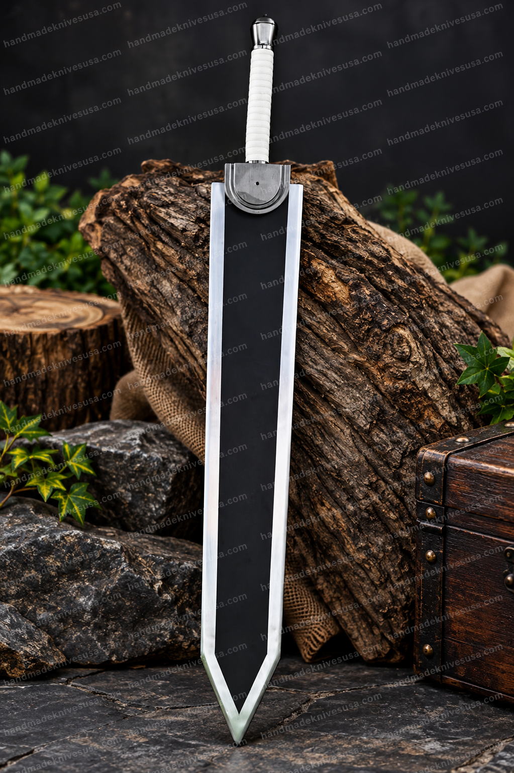Full-length view of the Berserk Guts Dragon Slayer sword replica with black and silver dual-tone blade